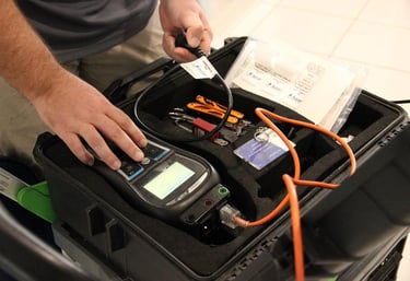 a man testing an electrical cable