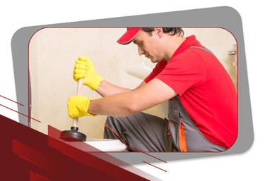 a man in a red shirt and yellow gloves
