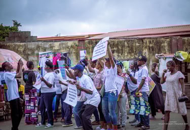 Image of Crowds holding placards with various wors promoting Sign Language.