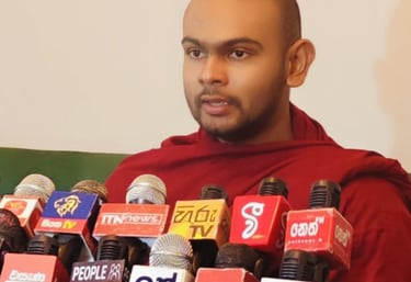 a man in a red robe is holding a microphone and microphone