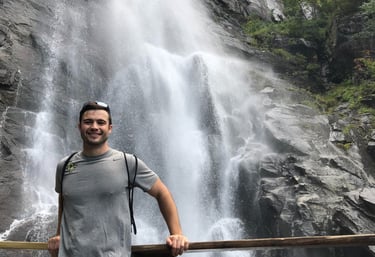 Travel physical therapist enjoying a waterfall on a weekend
