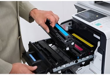 a man holding a printer and a printer