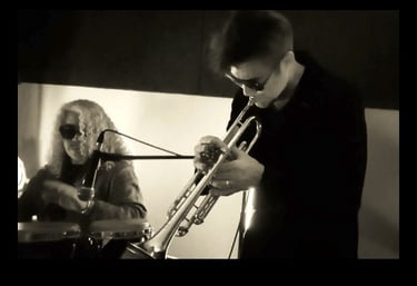 Benvenuto Electrojazz playing trumpet alongside percussionist, Nomads Spirits duo