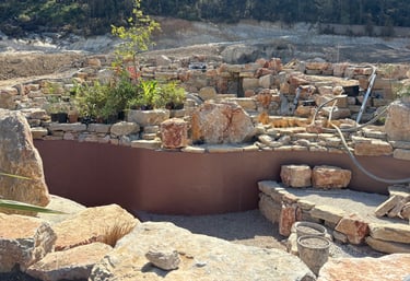 Natural pool with multiple levels, custom-colored walls & artisan stonework | Aqua Vitae build