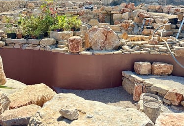 Natural pool with multiple levels, custom-colored walls & artisan stonework | Aqua Vitae build