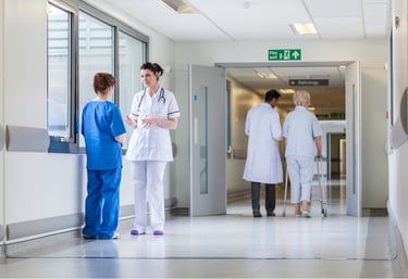  Hospital corridor with nurses and patients, representing healthcare security, staff control, and safe access management.