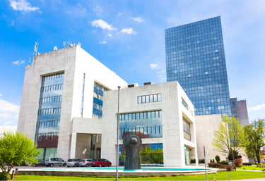 Modern office building with campus layout, symbolizing integrated surveillance and entry management