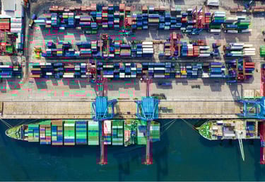Aerial view of smart seaport container terminal with automated entry systems and infrastructure monitoring using IX.Sentix
