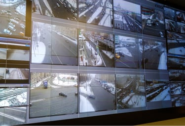 Centralized video wall displaying real-time highway surveillance footage for incident detection and response.