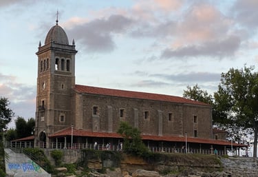 a large building with a clock tower in the middle of it