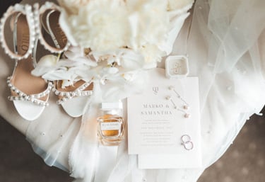 a wedding dress and shoes on a table