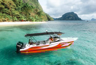 Private luxury yacht cruising through Bacuit Bay, El Nido.