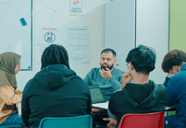 Dedicated tutor teaching students Excel skills for entrance exam preparation