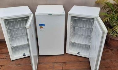 three refrigerators with a refrigerator and a planter