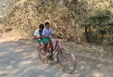 two boys go to school by bicycle
