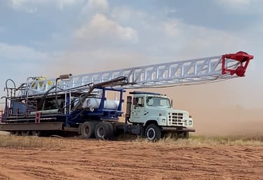 Phillips Drilling truck pulling drilling rig