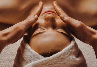 a woman getting a facial massage at a spa