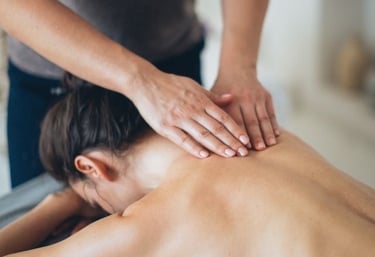 a woman getting a massage at a massager
