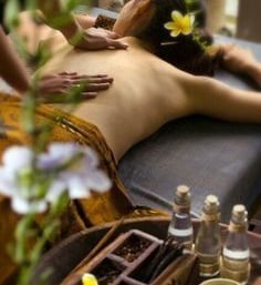 a woman getting a massage at a spa
