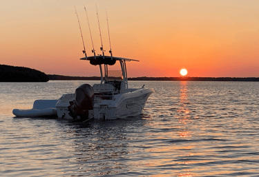 Boat on the water at sunset