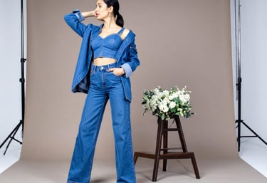 a woman in a blue top and jeans jeans