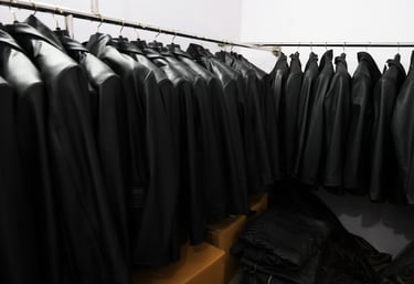a row of black leather jackets with black leather jackets