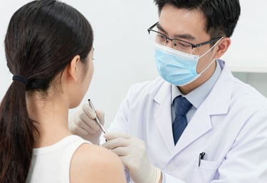 Close-up of hands typing on a laptop with a website showing location tracking features.