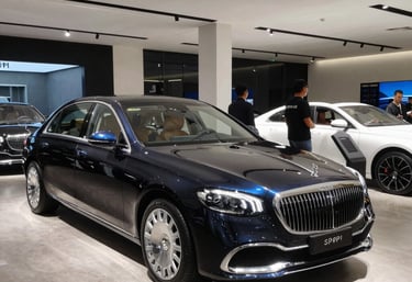 Close-up of hands reviewing credit reports and financial documents on a desk.