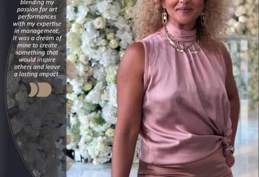 Nora Bouchaibi, Founder and CEO of Nora Dance Group, posing in a pink silk top against a floral backdrop.