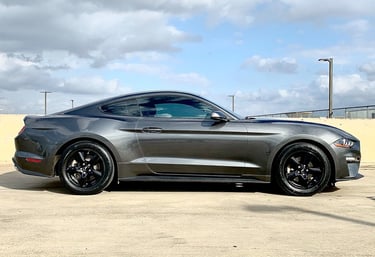 a mustang GT in a parking lot