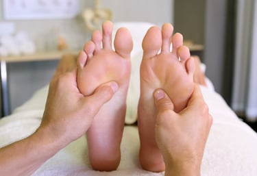 a person is getting a relaxing foot massage