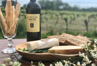 a bottle of wine and breadstickers on a table