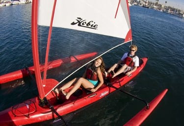 a woman and a man on a sailboat