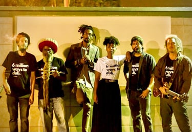a group of people standing in front of a wall