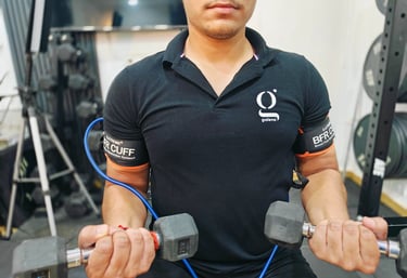 patient at Galena Physiotherapy in Noida wearing BFR (Blood Flow Restriction) cuffs for BFR Training