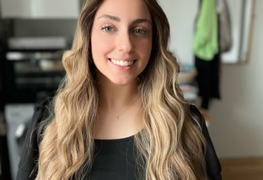 a woman with long blonde hair and a leopard print dress