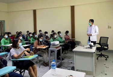 Dr Zaw giving a health talk in a room