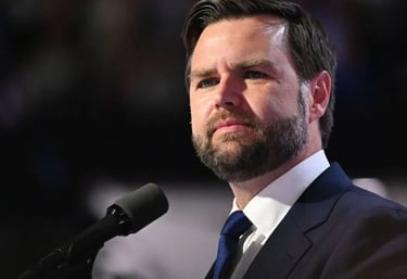 a man in a suit and tie is standing in front of a microphone