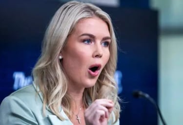 a woman in a green jacket and a microphone