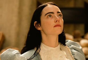 a woman in a blue jacket and white shirt