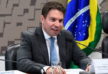 a man in a suit and tie is sitting at a table