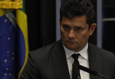 a man in a suit and tie is standing at a podium