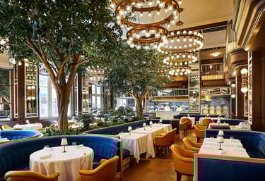 Elegant restaurant at The Fifth Avenue Hotel NYC with lush interiors and luxury dining ambiance.