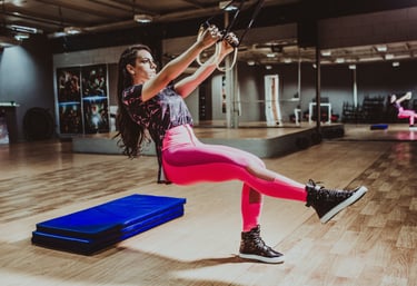 a woman in pink leggings and a pink top