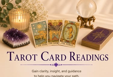 Spiritual tarot card reading layout with crystal ball, amethyst cluster, and lit candle for divination.