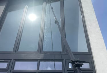 Extendable pole cleaning windows - outdoor cleaning services Fife
