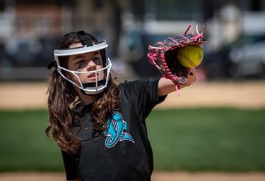 Photo of softball plater catching ball