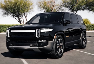a black suv parked in a parking lot