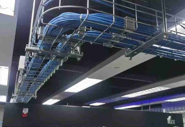 a rack of cables and cable tray in a server room