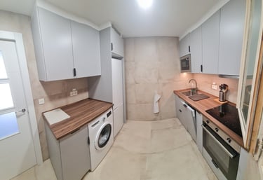 Fully equipped modern kitchen with updated appliances at Anne Apartment.